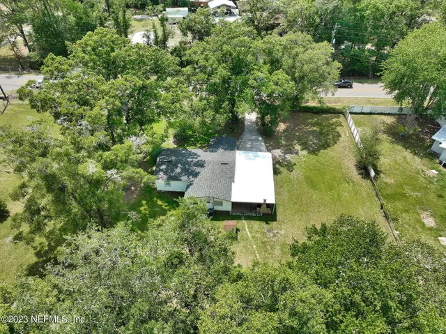 a swimming pool with trees in the background
