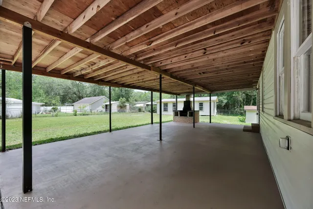 a view of a backyard of the house