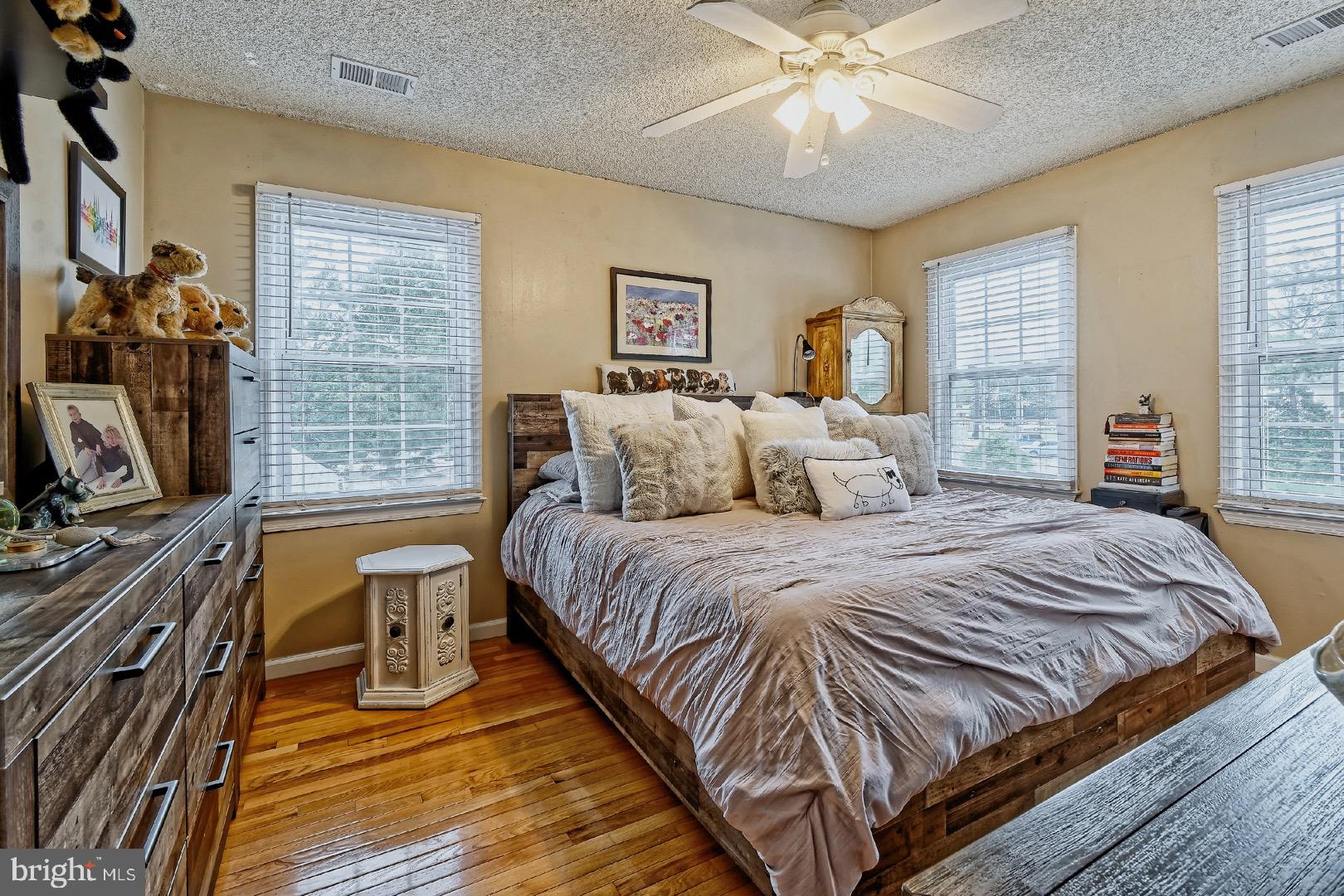 84 Jennings Road Manahawkin, NJ 08050 - Photo 19 of 40 a bedroom with a bed and a flat tv screen on dresser