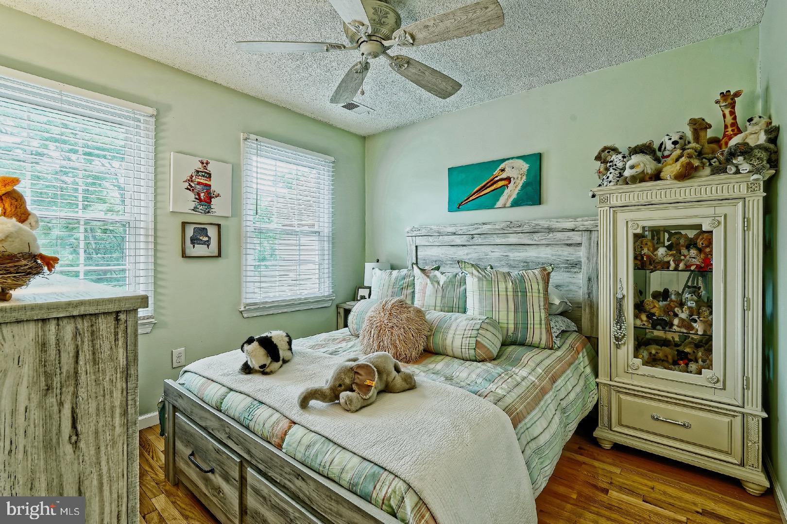 84 Jennings Road Manahawkin, NJ 08050 - Photo 20 of 40 a bedroom with a bed and a fireplace