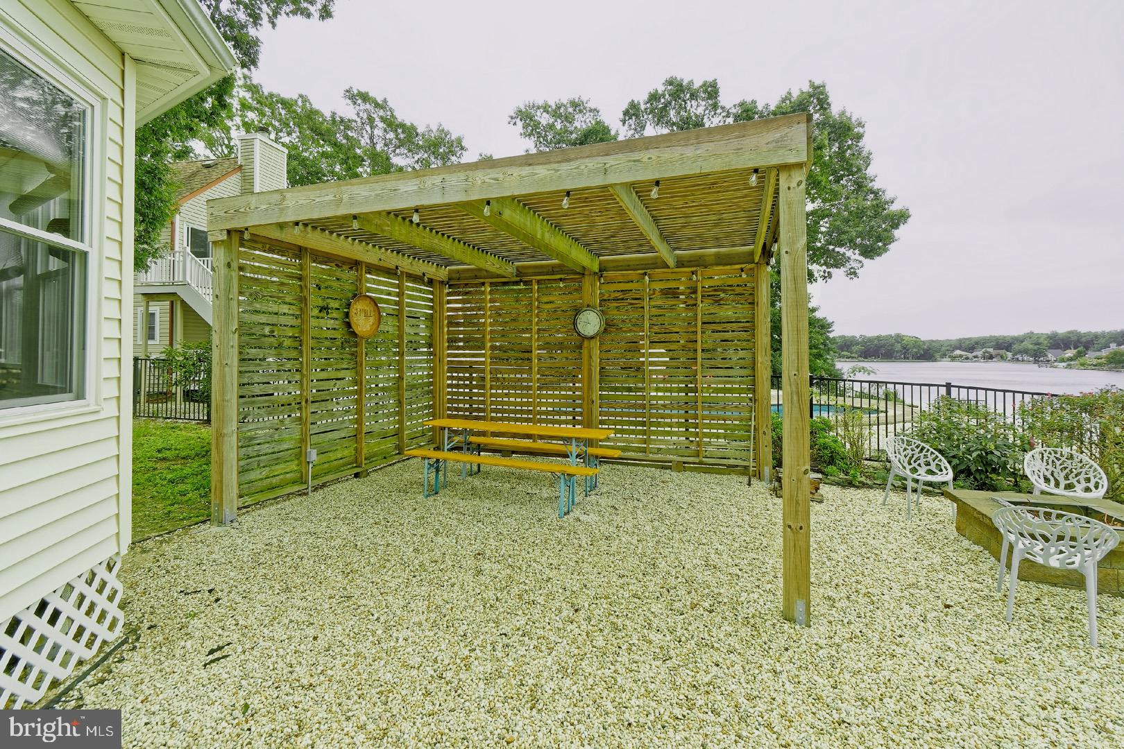 84 Jennings Road Manahawkin, NJ 08050 - Photo 34 of 40 a backyard of a house with lots of green space and outdoor seating