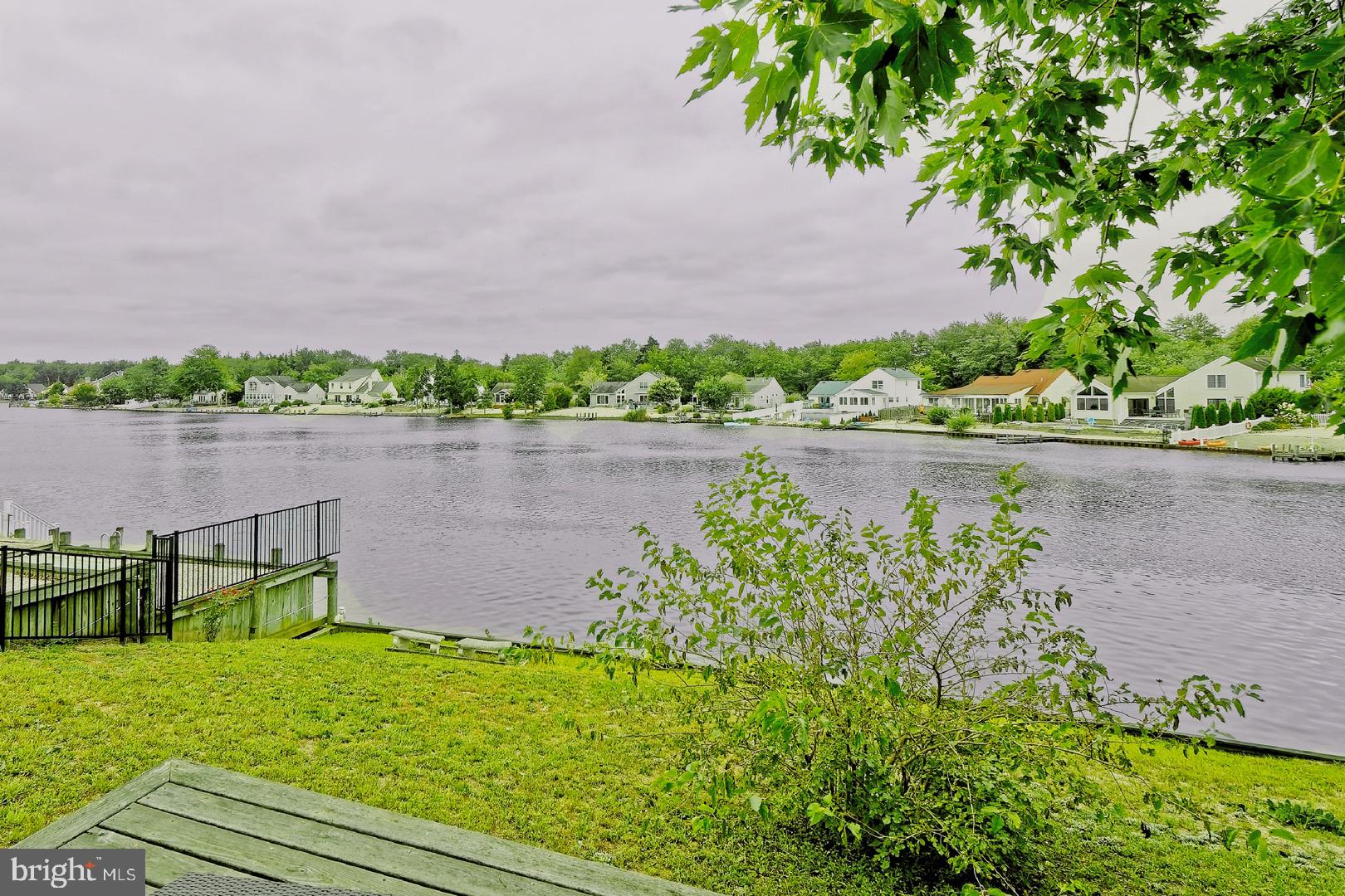 84 Jennings Road Manahawkin, NJ 08050 - Photo 36 of 40 a backyard of a house with a garden and outdoor seating