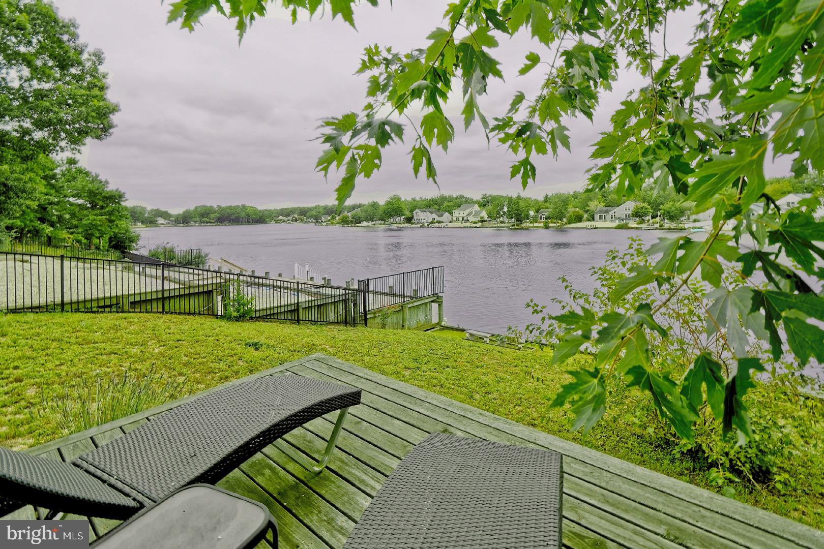 84 Jennings Road Manahawkin, NJ 08050 - Photo 38 of 40 a view of a backyard with plants and a lake view