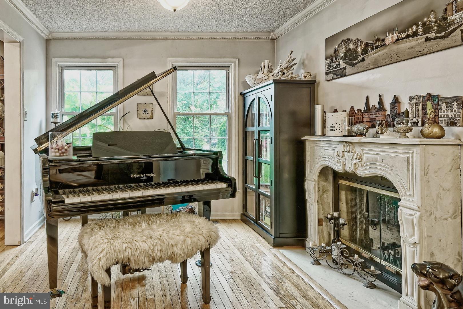 84 Jennings Road Manahawkin, NJ 08050 - Photo 9 of 40 a living room with furniture a fireplace and a window