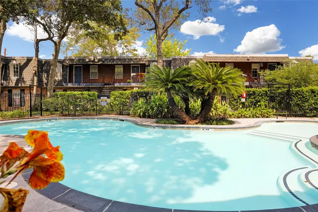 a view of swimming pool from a outdoor seating