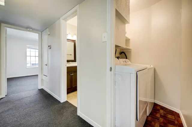a view of a livingroom with wooden floor and entryway