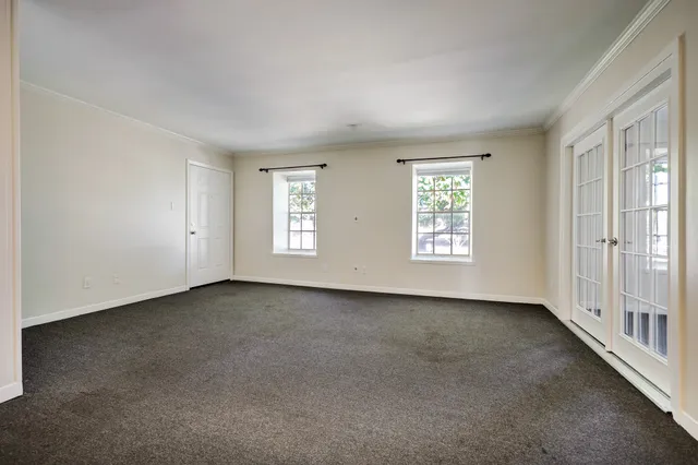 an empty room with windows