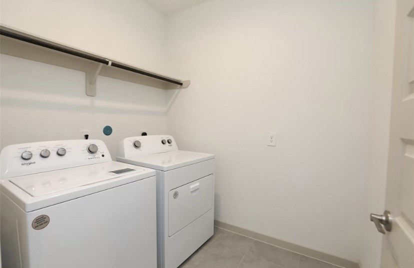 7311 Ramsgate Cliff Lane Richmond, TX 77407 - Photo 17 of 21 a utility room with dryer and washer