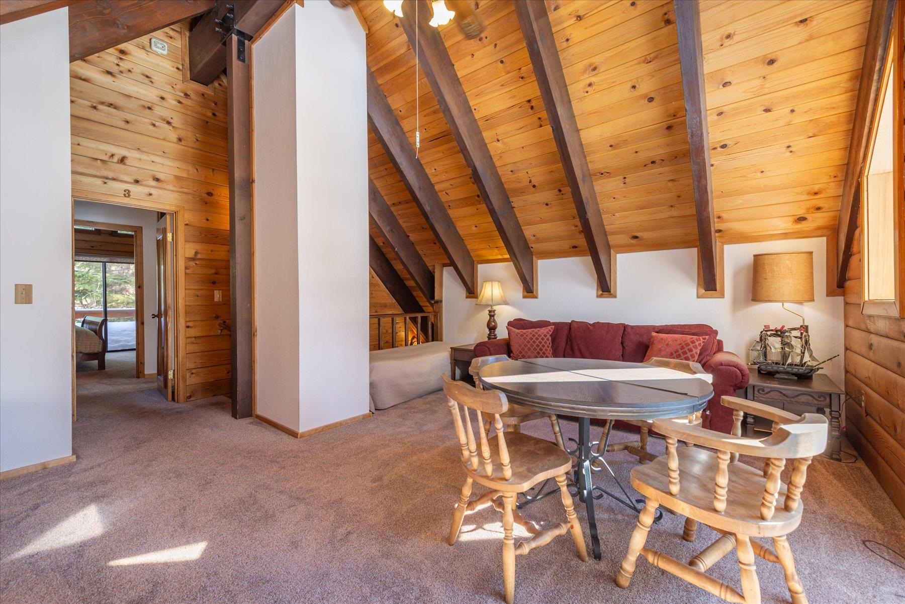 17080 Ski Slope Way Truckee, CA 96161 - Photo 11 of 22 a view of a dining room with furniture and wooden floor