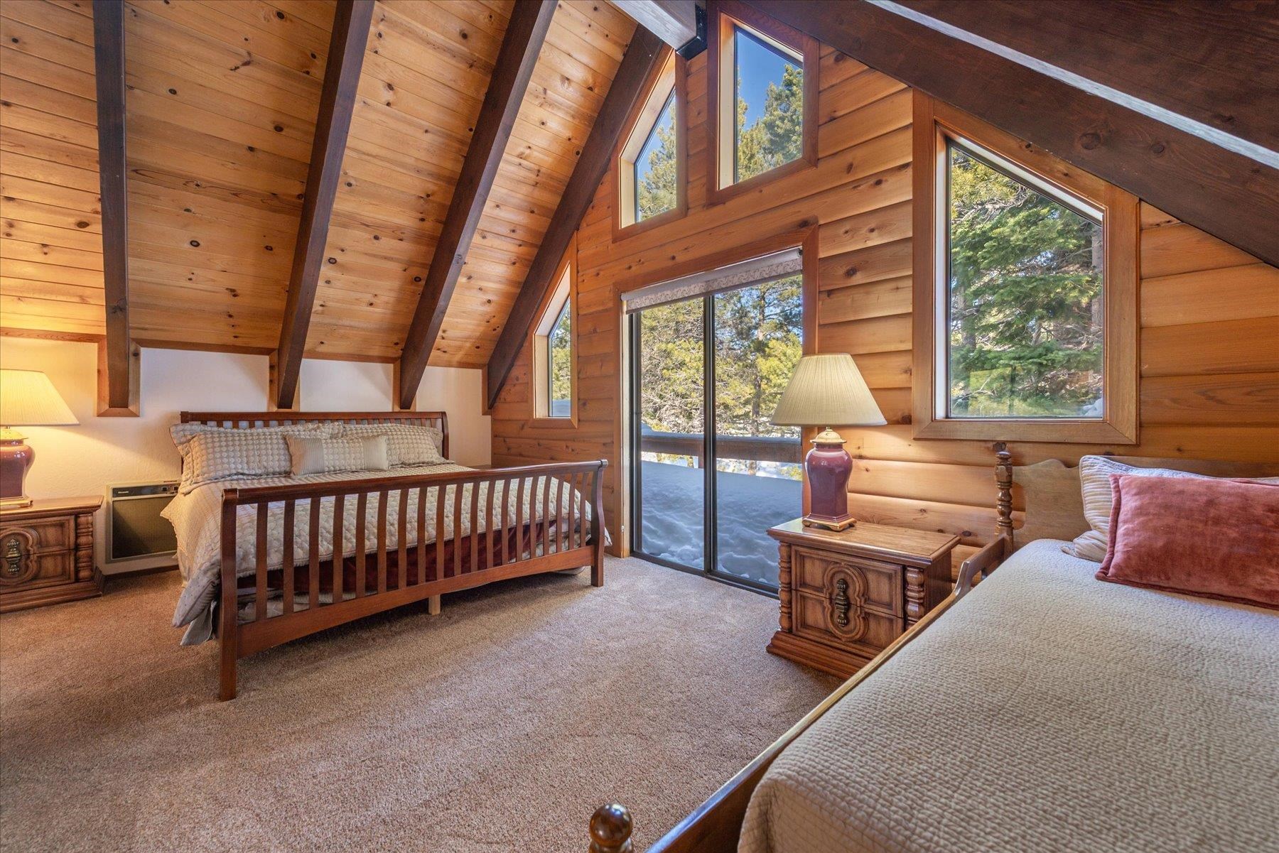 17080 Ski Slope Way Truckee, CA 96161 - Photo 20 of 22 a bedroom with furniture and a large window