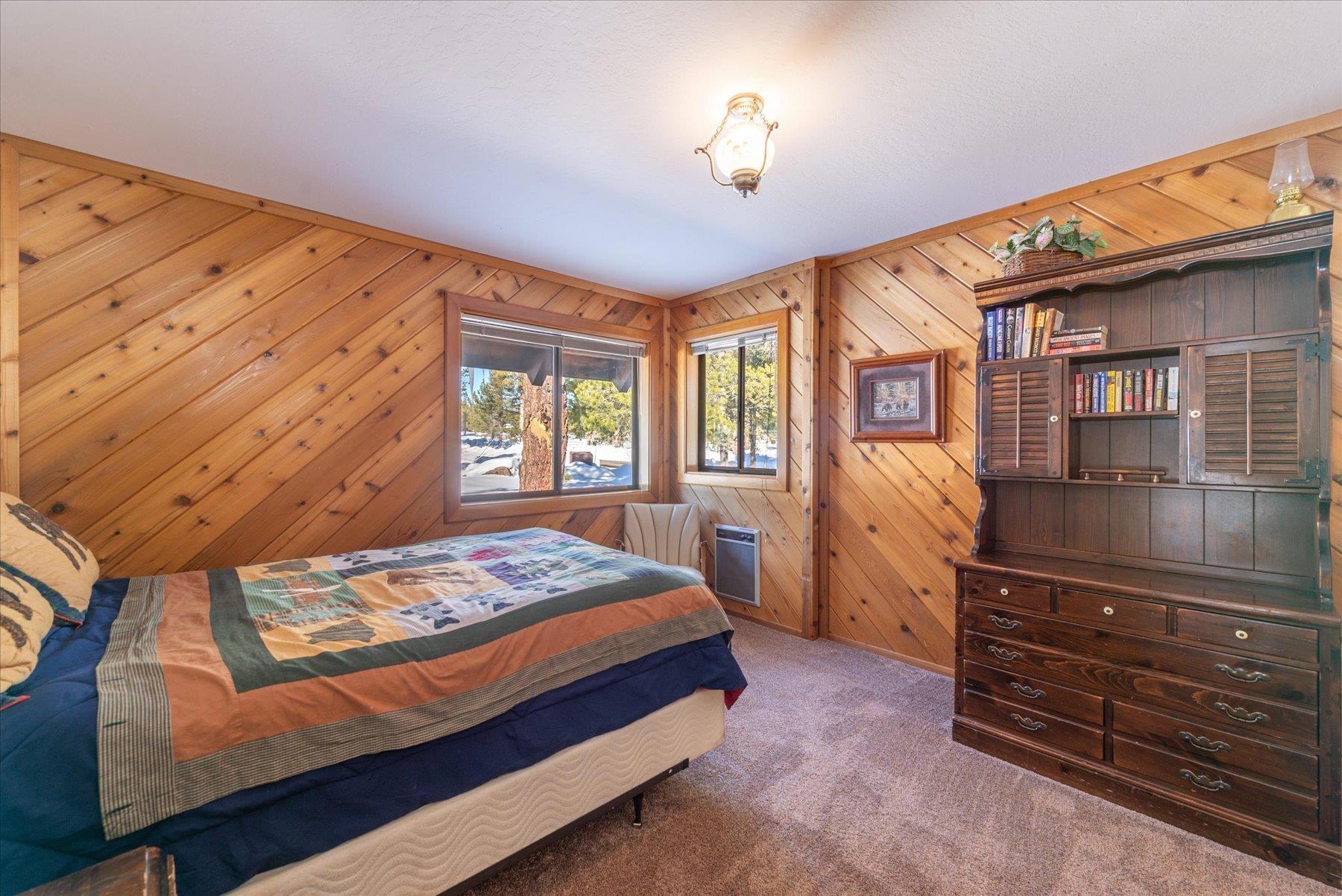 17080 Ski Slope Way Truckee, CA 96161 - Photo 6 of 22 a bedroom with a bed and wooden floor