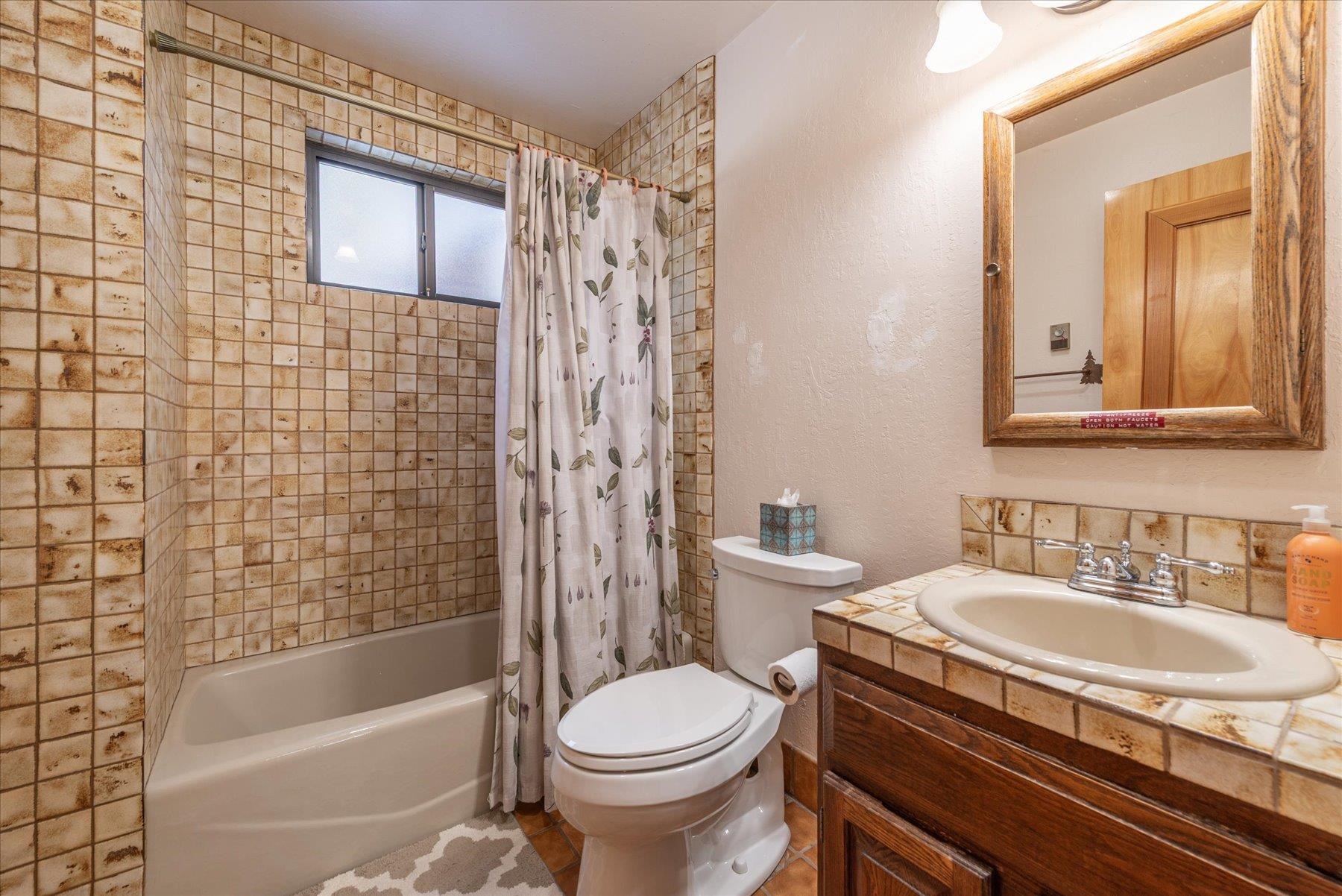 17080 Ski Slope Way Truckee, CA 96161 - Photo 8 of 22 a bathroom with a sink toilet and shower