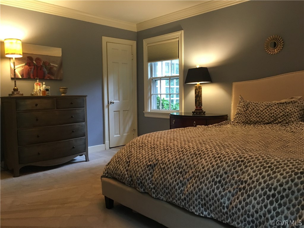 300 Ralston Road Henrico, VA 23229 - Photo 11 of 14 a bedroom with a bed and mirror