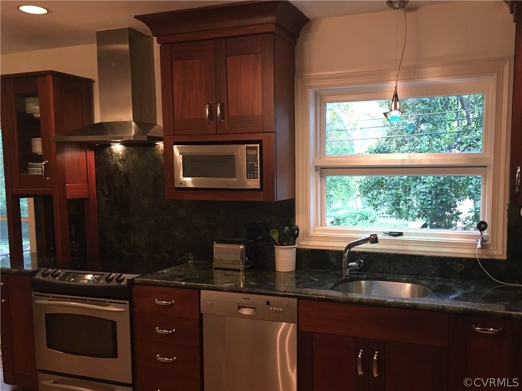300 Ralston Road Henrico, VA 23229 - Photo 6 of 14 a kitchen with stainless steel appliances granite countertop a sink a stove and a microwave