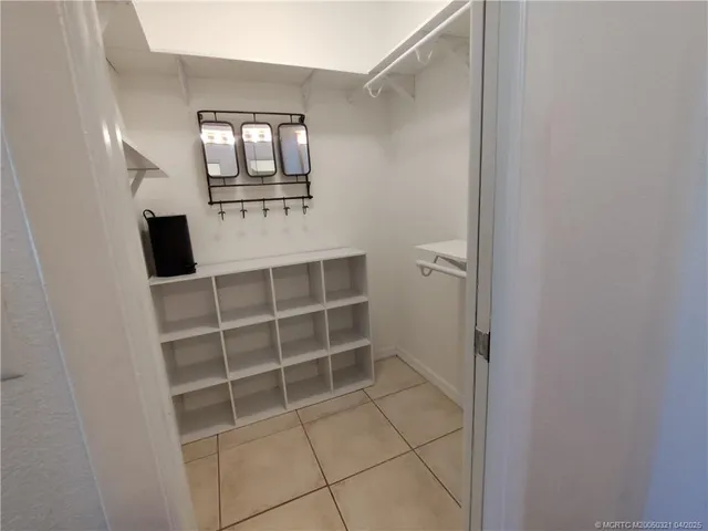 a view of a livingroom with a hardwood and staircase