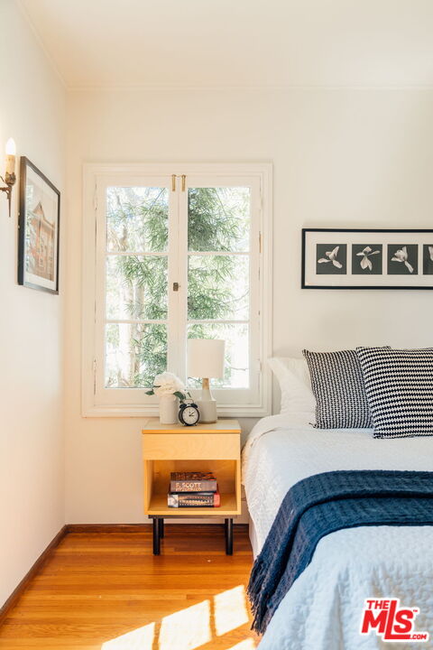 2101 Lambert Drive Pasadena, CA 91107 - Photo 19 of 48 a bedroom with a bed and wooden floor