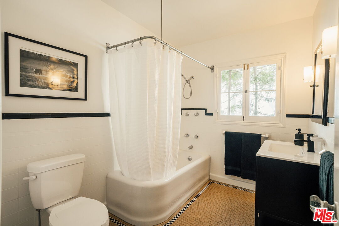 2101 Lambert Drive Pasadena, CA 91107 - Photo 22 of 48 a bathroom with a toilet sink and tub