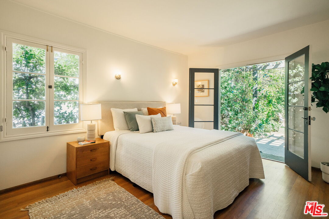 2101 Lambert Drive Pasadena, CA 91107 - Photo 25 of 48 a bedroom with a bed and a large window