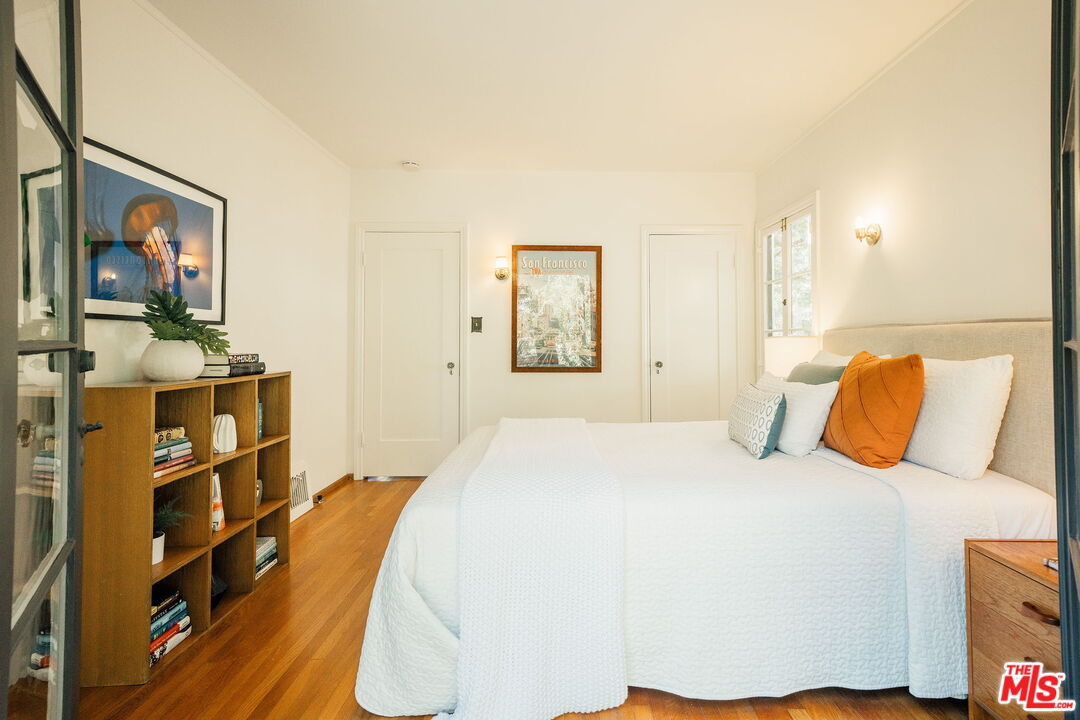 2101 Lambert Drive Pasadena, CA 91107 - Photo 27 of 48 a bedroom with a bed and a flat screen tv