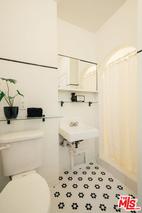 2101 Lambert Drive Pasadena, CA 91107 - Photo 31 of 48 a bathroom with a sink a toilet and a shower