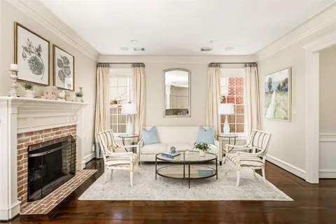 a living room with furniture fireplace and flat screen tv