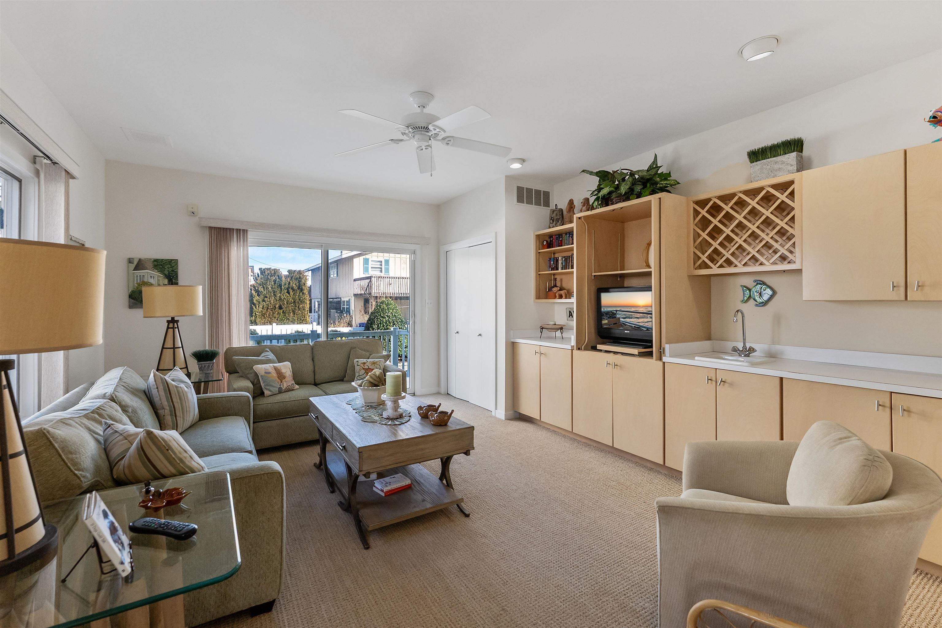 177 71st Street Avalon, NJ 08202 - Photo 12 of 44 a living room with furniture and a window