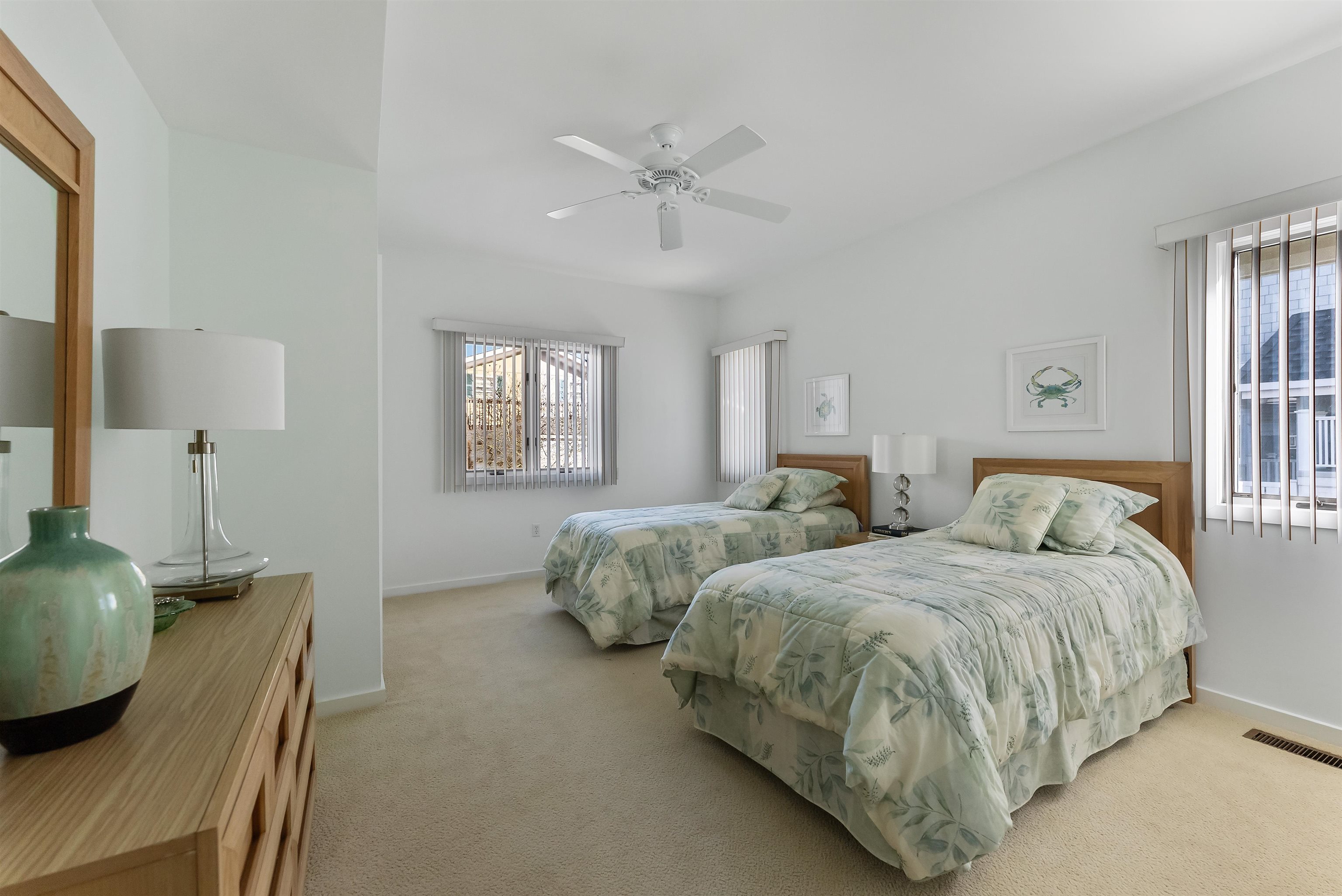 177 71st Street Avalon, NJ 08202 - Photo 14 of 44 a bedroom with two beds and a window