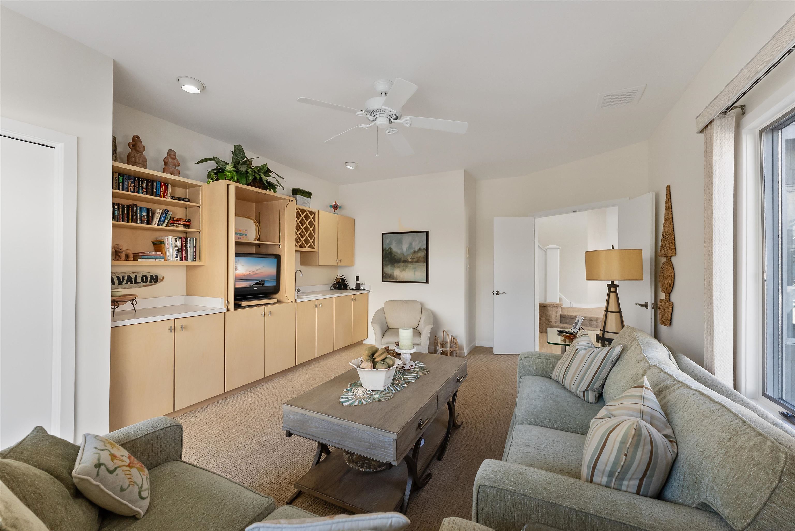 177 71st Street Avalon, NJ 08202 - Photo 19 of 44 a living room with furniture and a flat screen tv