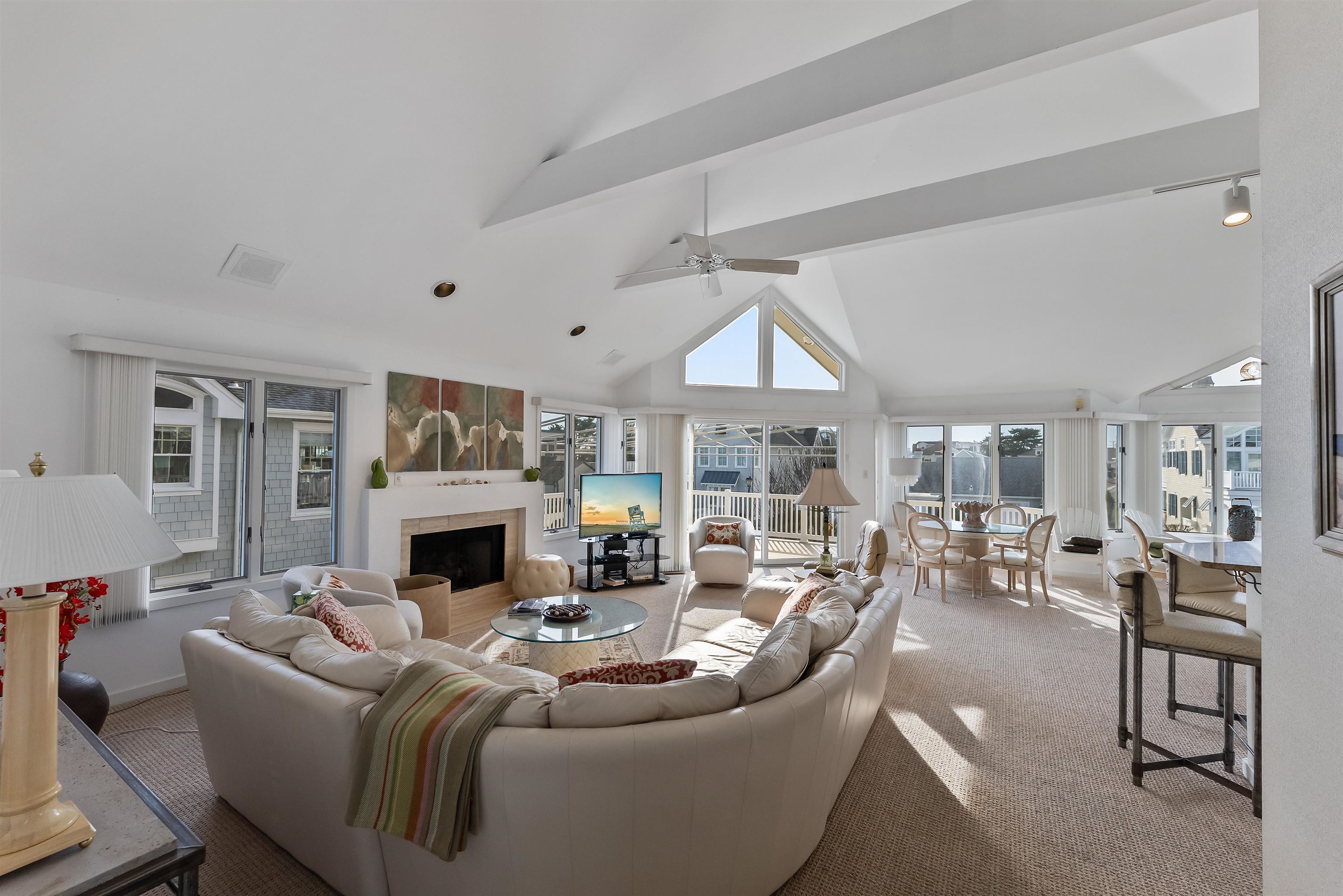 177 71st Street Avalon, NJ 08202 - Photo 28 of 44 a living room with furniture a fireplace and a large window
