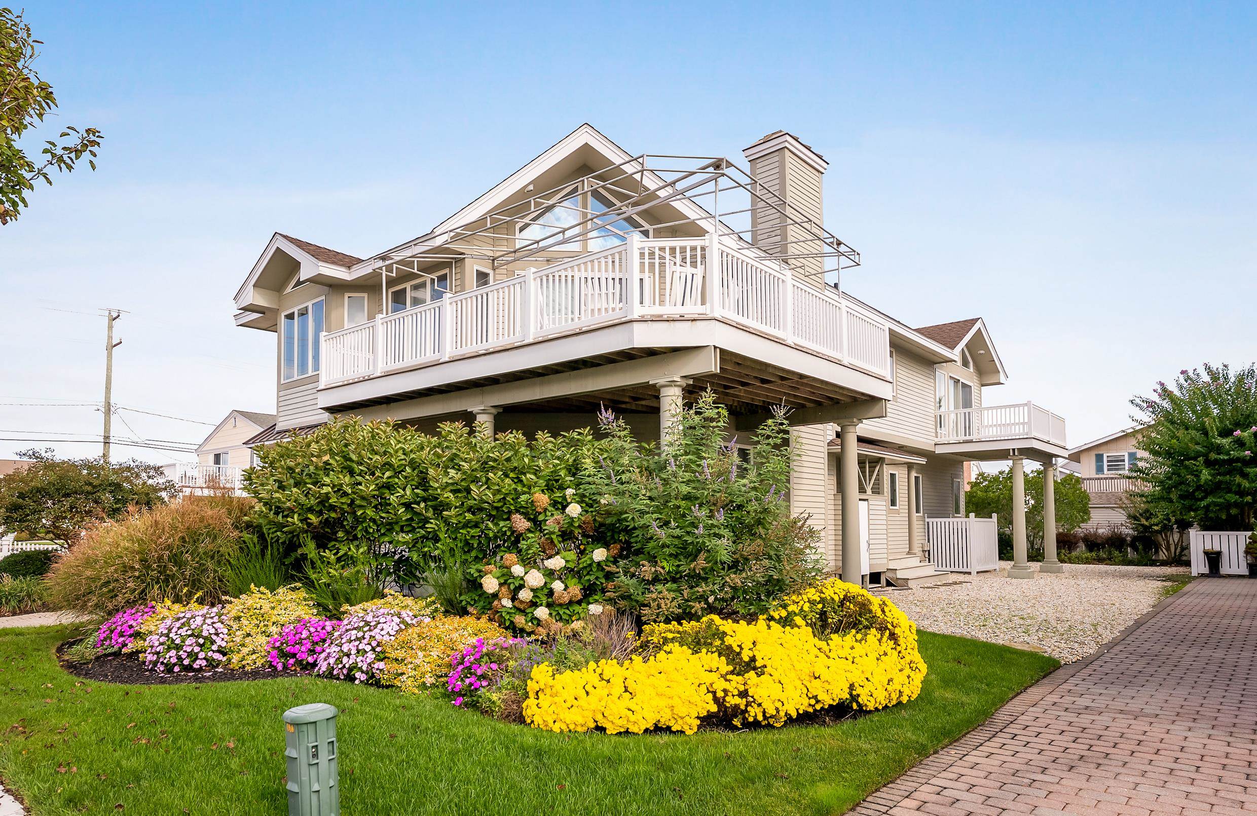 177 71st Street Avalon, NJ 08202 - Photo 3 of 44 a front view of a house with a yard