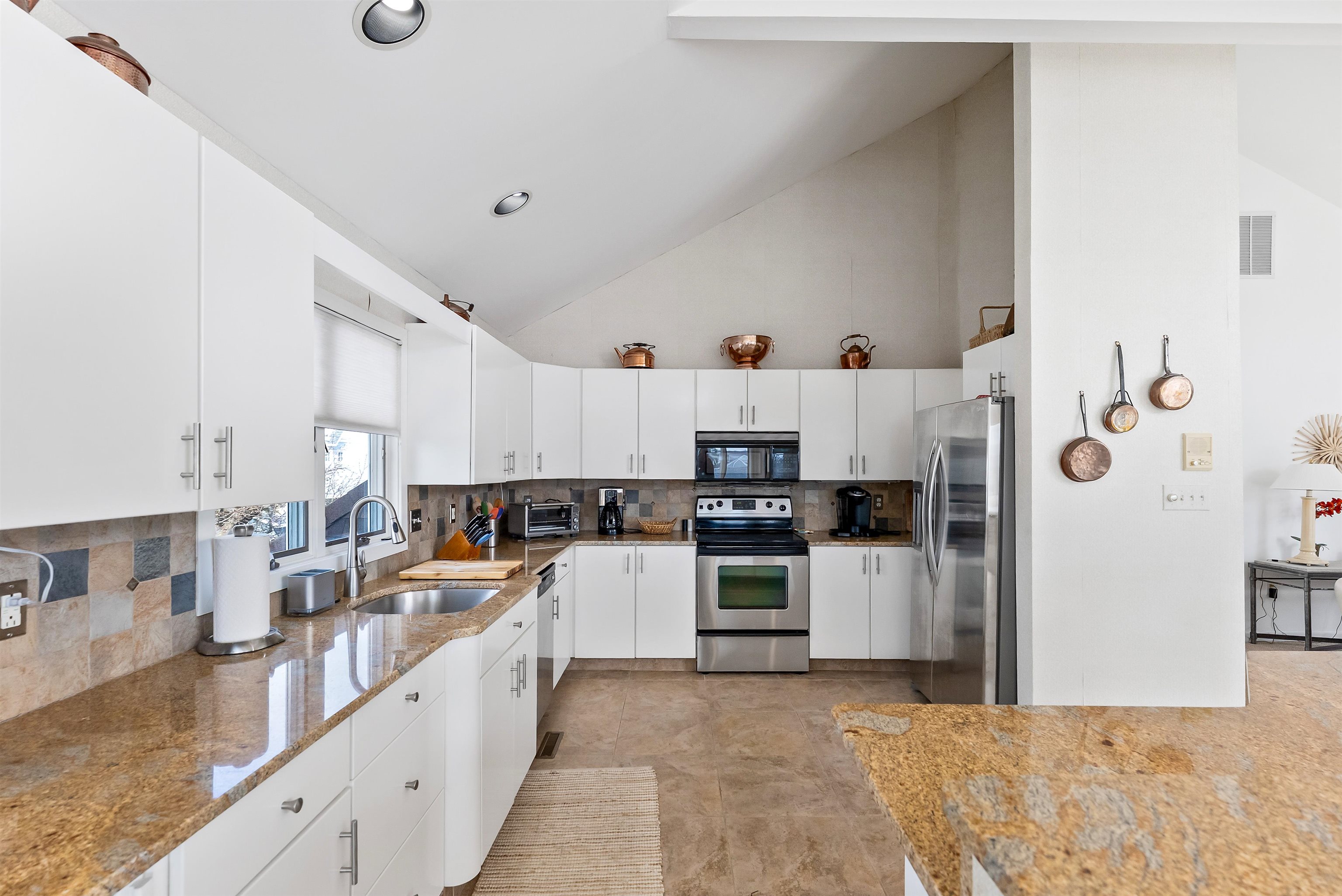 177 71st Street Avalon, NJ 08202 - Photo 33 of 44 a large kitchen with stainless steel appliances lots of counter space and a sink