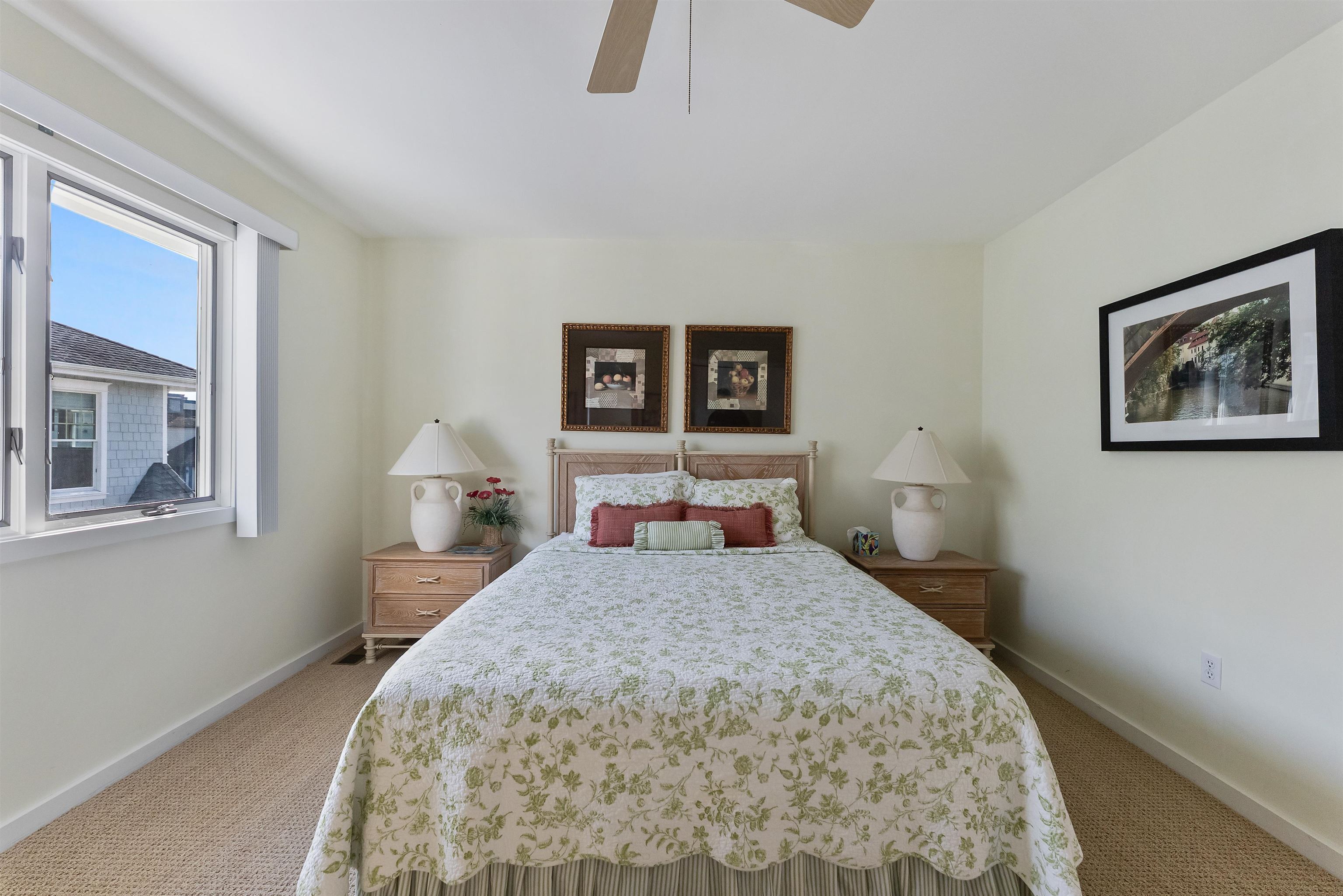 177 71st Street Avalon, NJ 08202 - Photo 34 of 44 a bedroom with a large bed and a chandelier