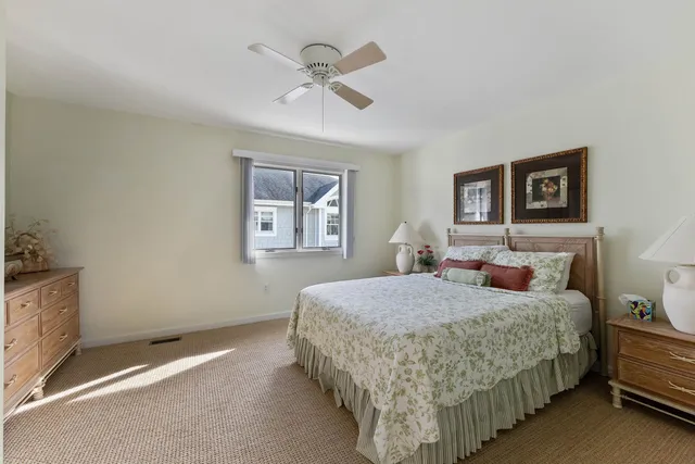 a bedroom with a bed and a chair