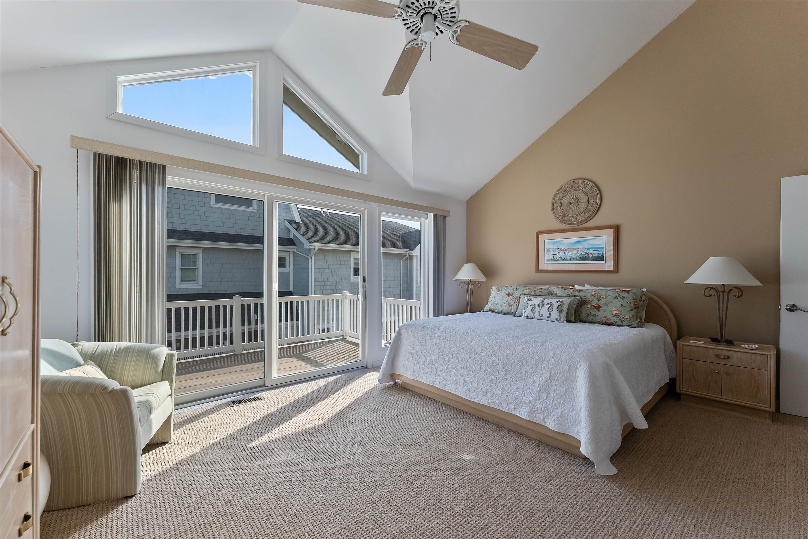 177 71st Street Avalon, NJ 08202 - Photo 39 of 44 a bedroom with a bed and a chair