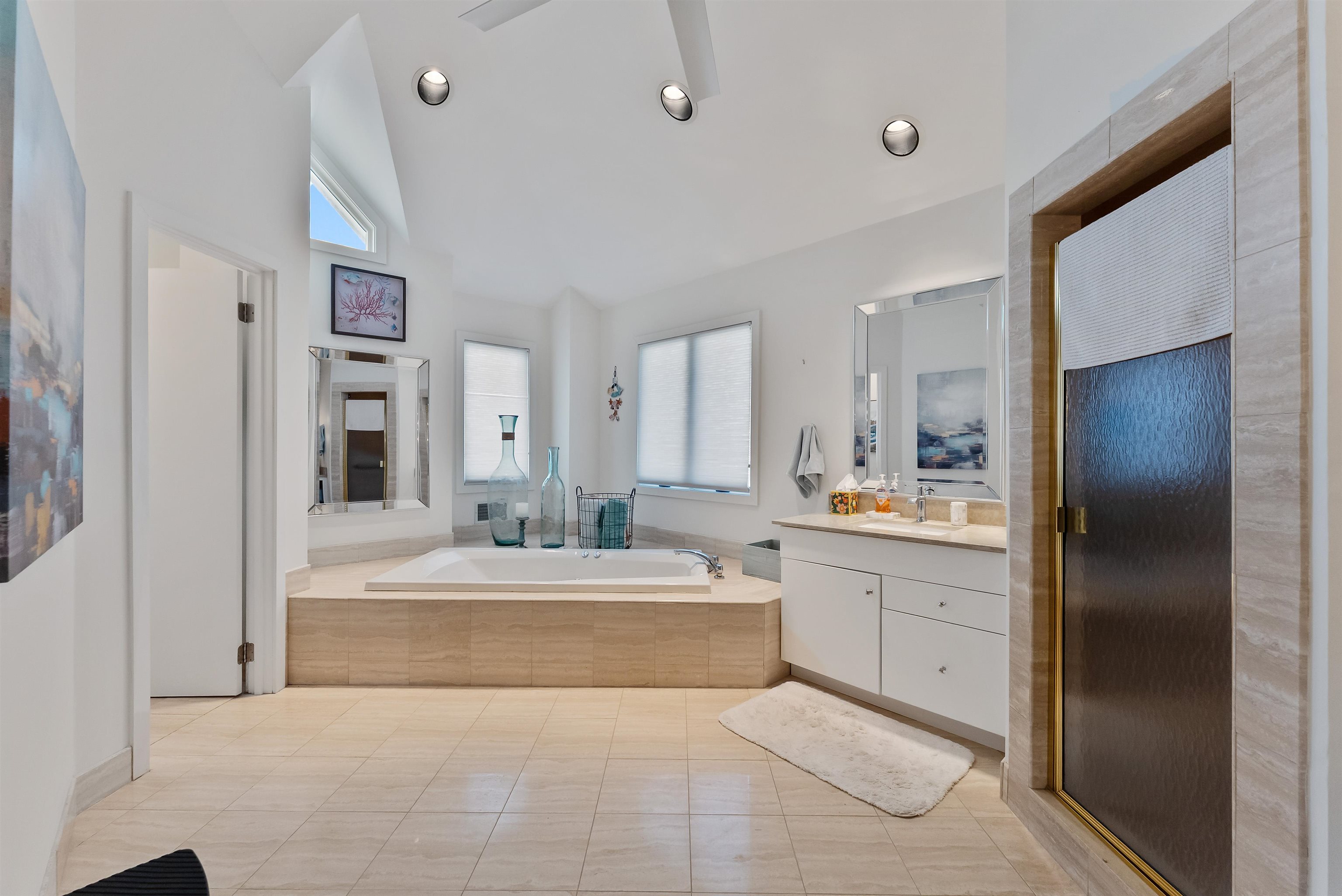 177 71st Street Avalon, NJ 08202 - Photo 41 of 44 a large bedroom with a large bed and chandelier