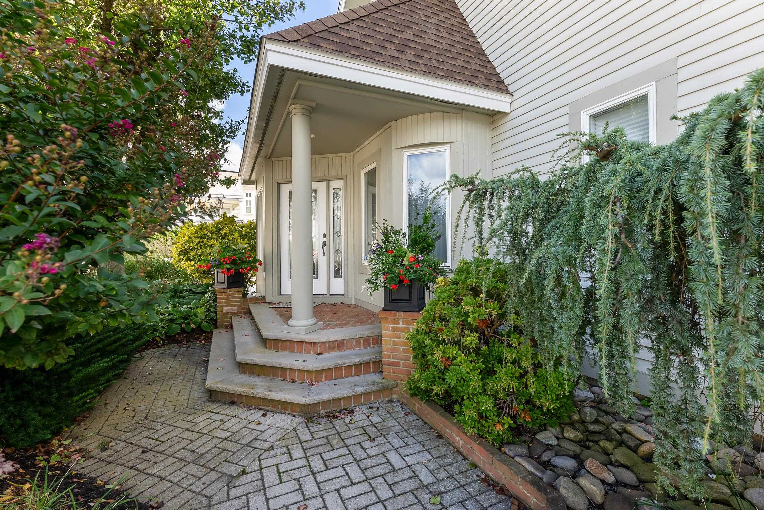 177 71st Street Avalon, NJ 08202 - Photo 9 of 44 a view of a house with a fountain and plants