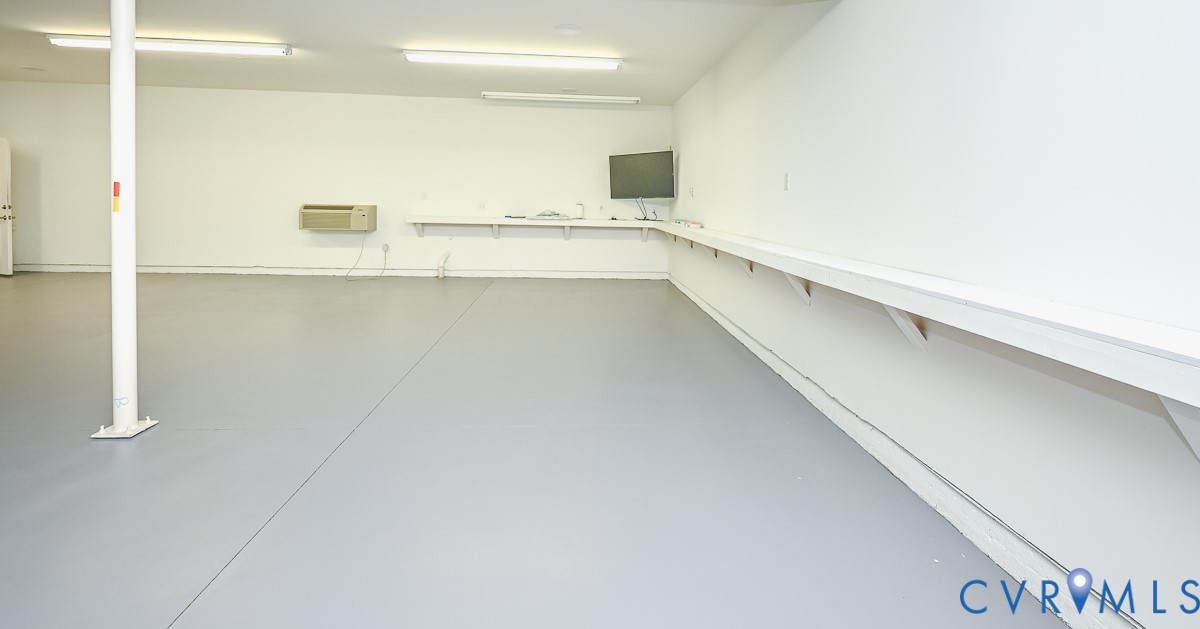 1037 Berryhill Road Henrico, VA 23231 - Photo 24 of 49 Conditioned Work/Mancave area with TV and Shelf