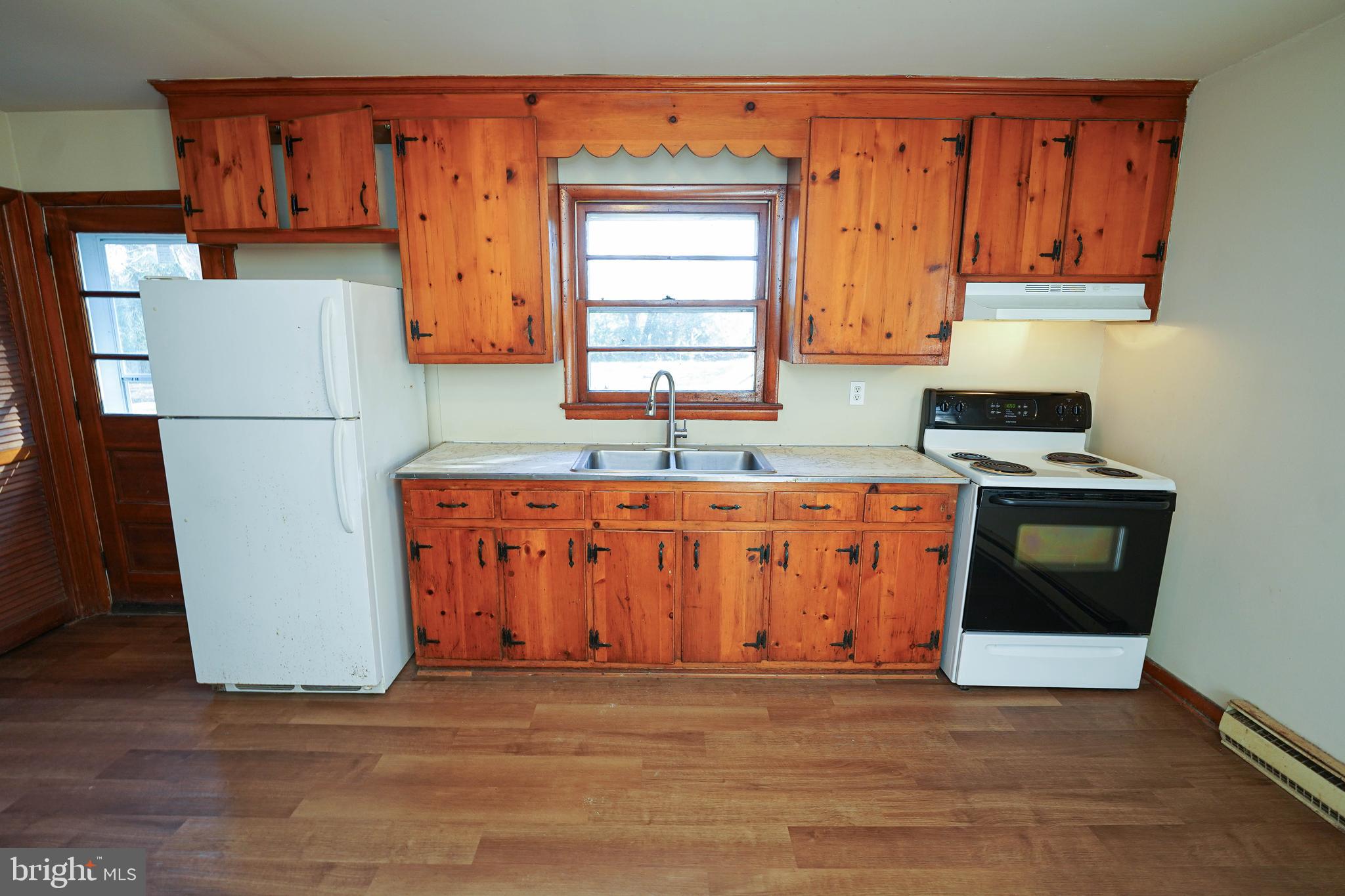 5643 Rip Wil Drive Salisbury, MD 21804 - Photo 13 of 34 a kitchen with stainless steel appliances granite countertop a refrigerator a stove a sink and a microwave