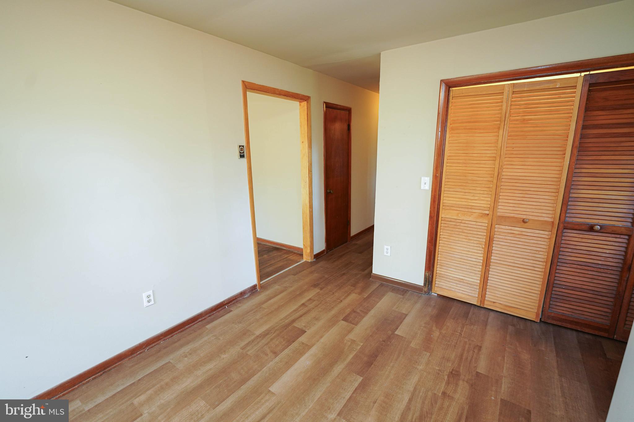 5643 Rip Wil Drive Salisbury, MD 21804 - Photo 15 of 34 an empty room with wooden floor and a window