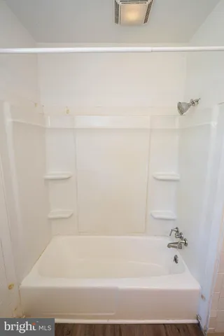 a bathroom with bathtub