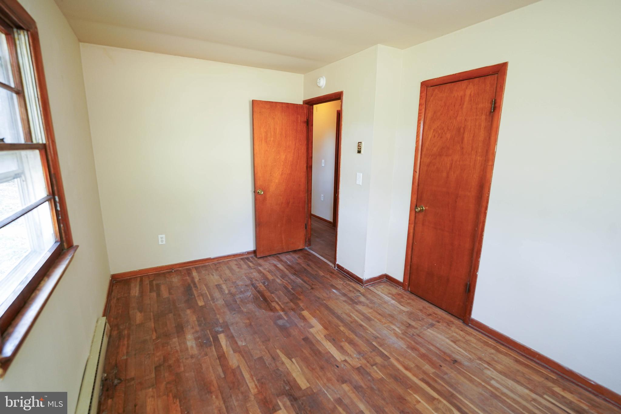 5643 Rip Wil Drive Salisbury, MD 21804 - Photo 29 of 34 a view of an empty room with wooden floor and a window