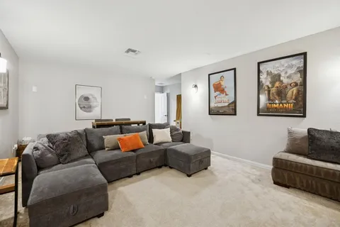 a living room with furniture and a couch