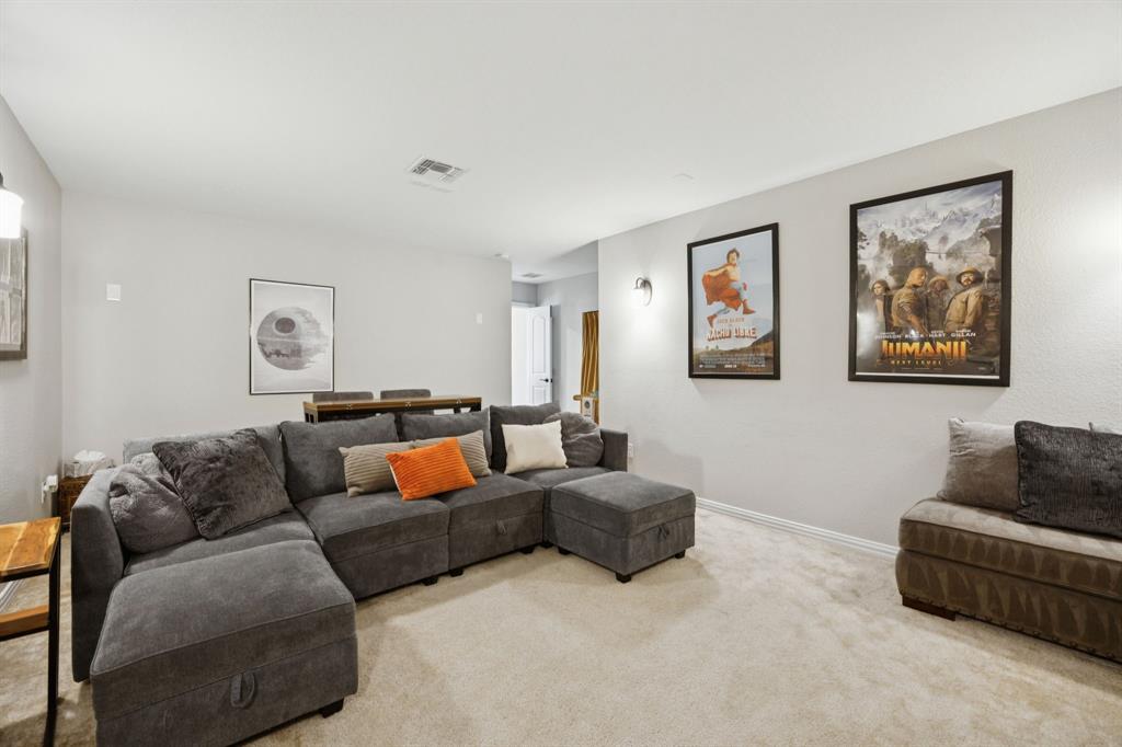 2448 Jack Rabbit Way Northlake, TX 76247 - Photo 22 of 40 a living room with furniture and a couch