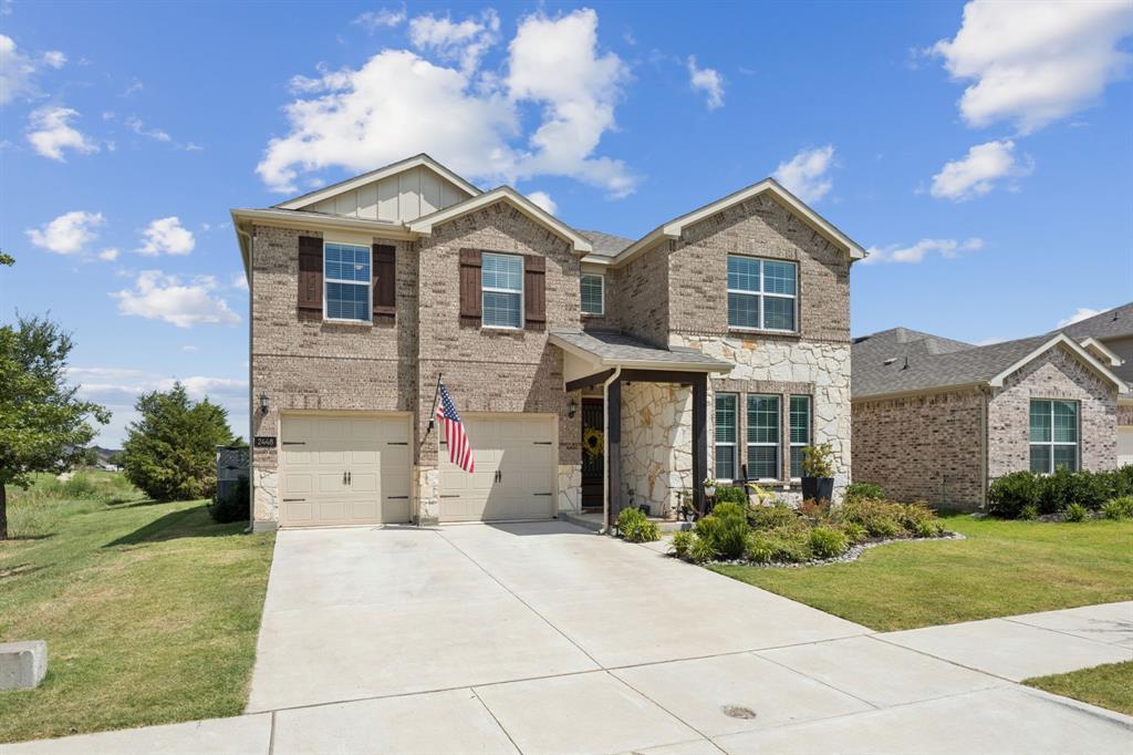 2448 Jack Rabbit Way Northlake, TX 76247 - Photo 26 of 40 a front view of a house with a yard