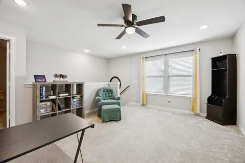 a view of workspace with a window and furniture