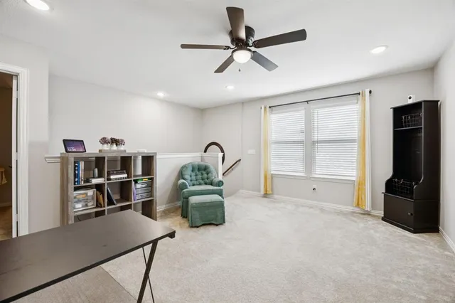 a view of workspace with a window and furniture