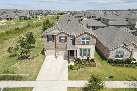 an aerial view of a house with a garden