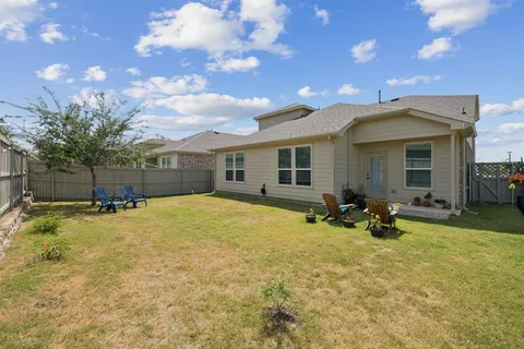 a view of a house with outdoor space and sitting area