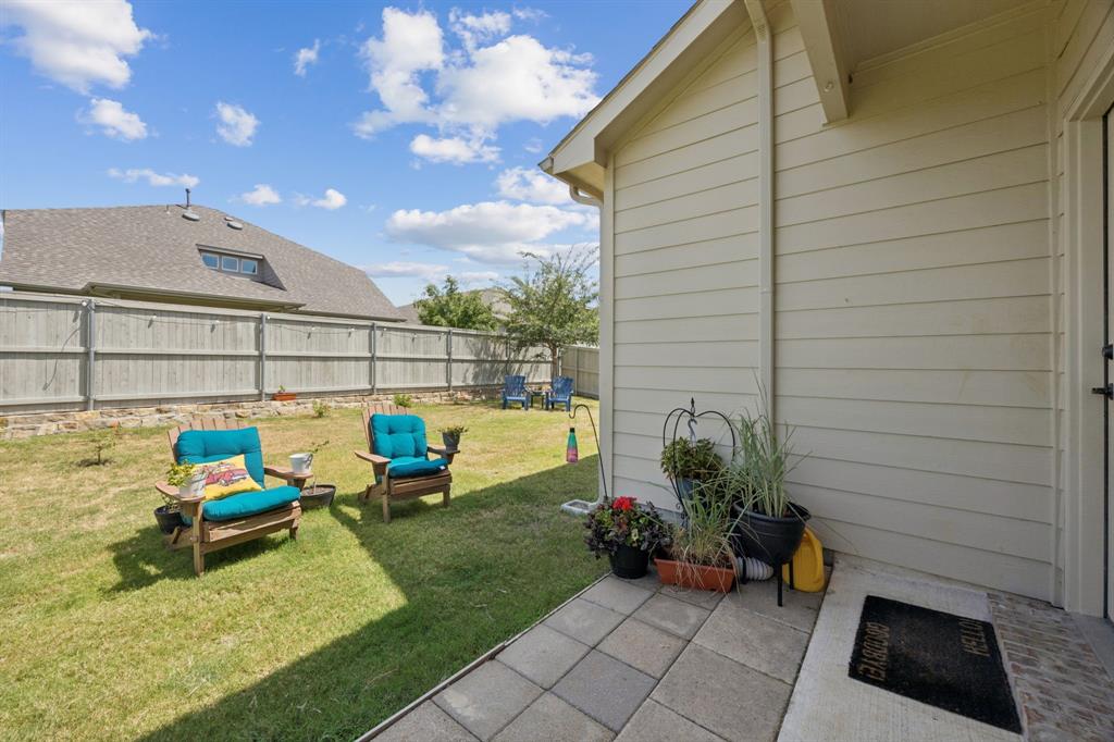 2448 Jack Rabbit Way Northlake, TX 76247 - Photo 32 of 40 a view of a chairs and table in patio
