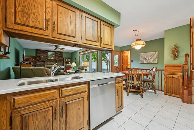 a kitchen with stainless steel appliances granite countertop a sink and cabinets